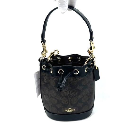Coach Handbags - NWT Coach Mini Bucket Bag In Signature Canvas in Walnut/Black CW299